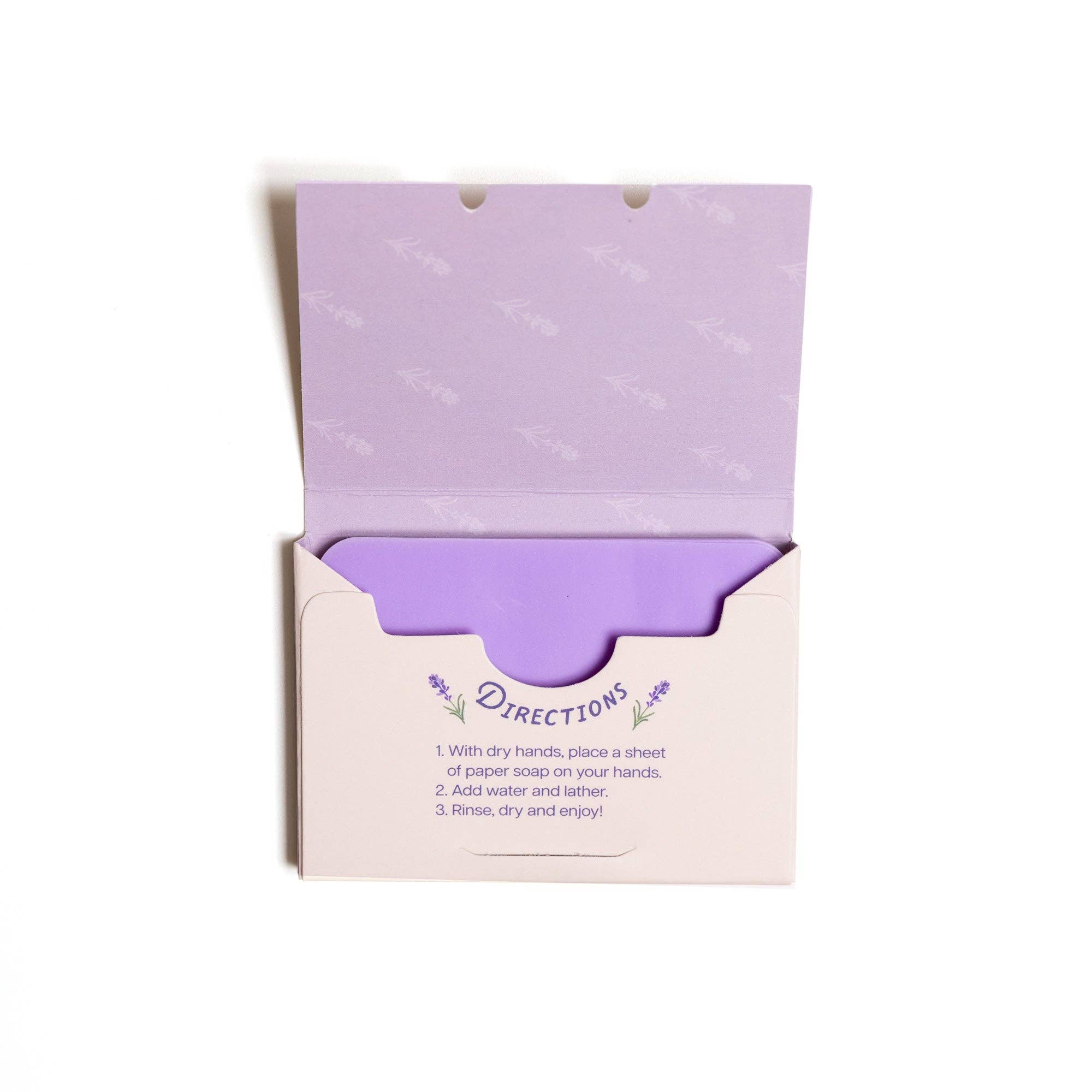 Inside view of lavender soap sheets box with purple floral pattern, showing neatly stacked soap sheets for hand cleaning