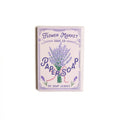 Lavender paper soap sheets box with purple floral design, open lid showing soap sheets, eco-friendly packaging for travel use