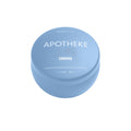 Light blue round candle container with white text reading 'APOTHEKE' and 'CANVAS', made of premium soy wax, small size, home decor