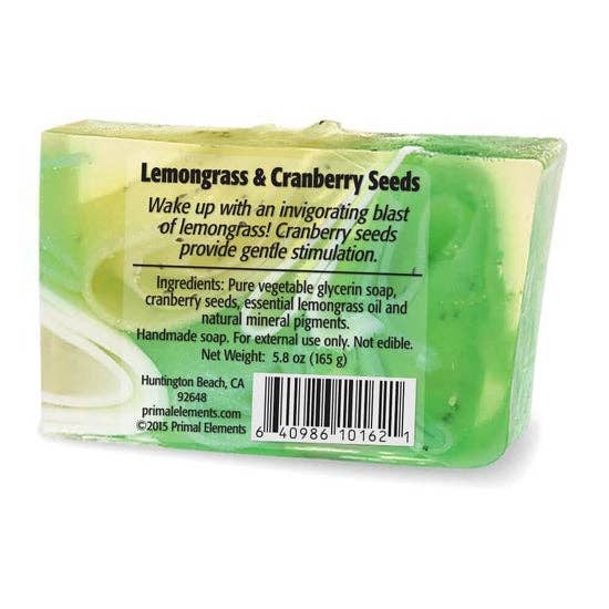 Back view of a soap bar with ingredients label, featuring natural ingredients like cranberry seeds and essential oils for skincare.