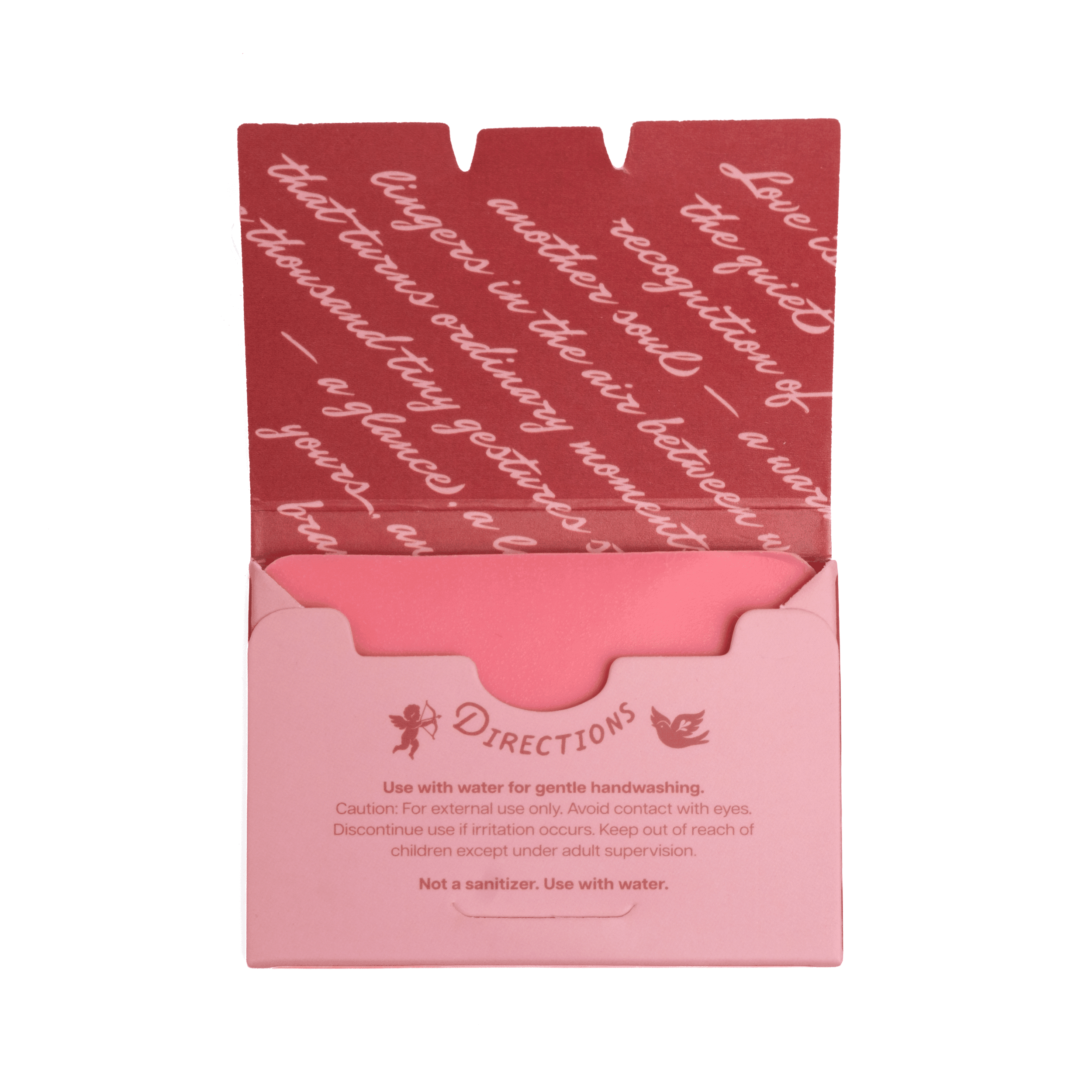 Close-up of pink paper soap box with instructions for use, featuring decorative rose and bird border design, containing 50 sheets.