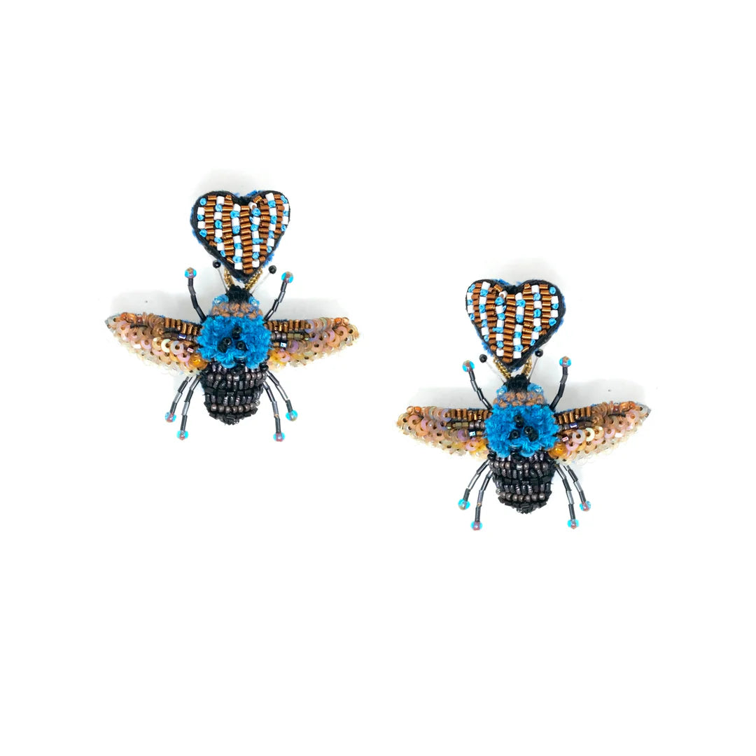 Beaded bee-shaped earrings with black, blue, and beige beads, featuring heart-shaped antennae and intricate wing details, handmade jewelry