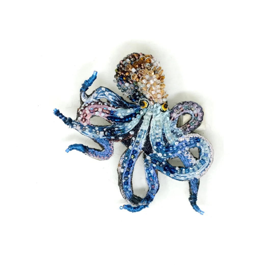 Artisan octopus brooch featuring multicolored beads and detailed craftsmanship, ideal for distinctive accessory styling.