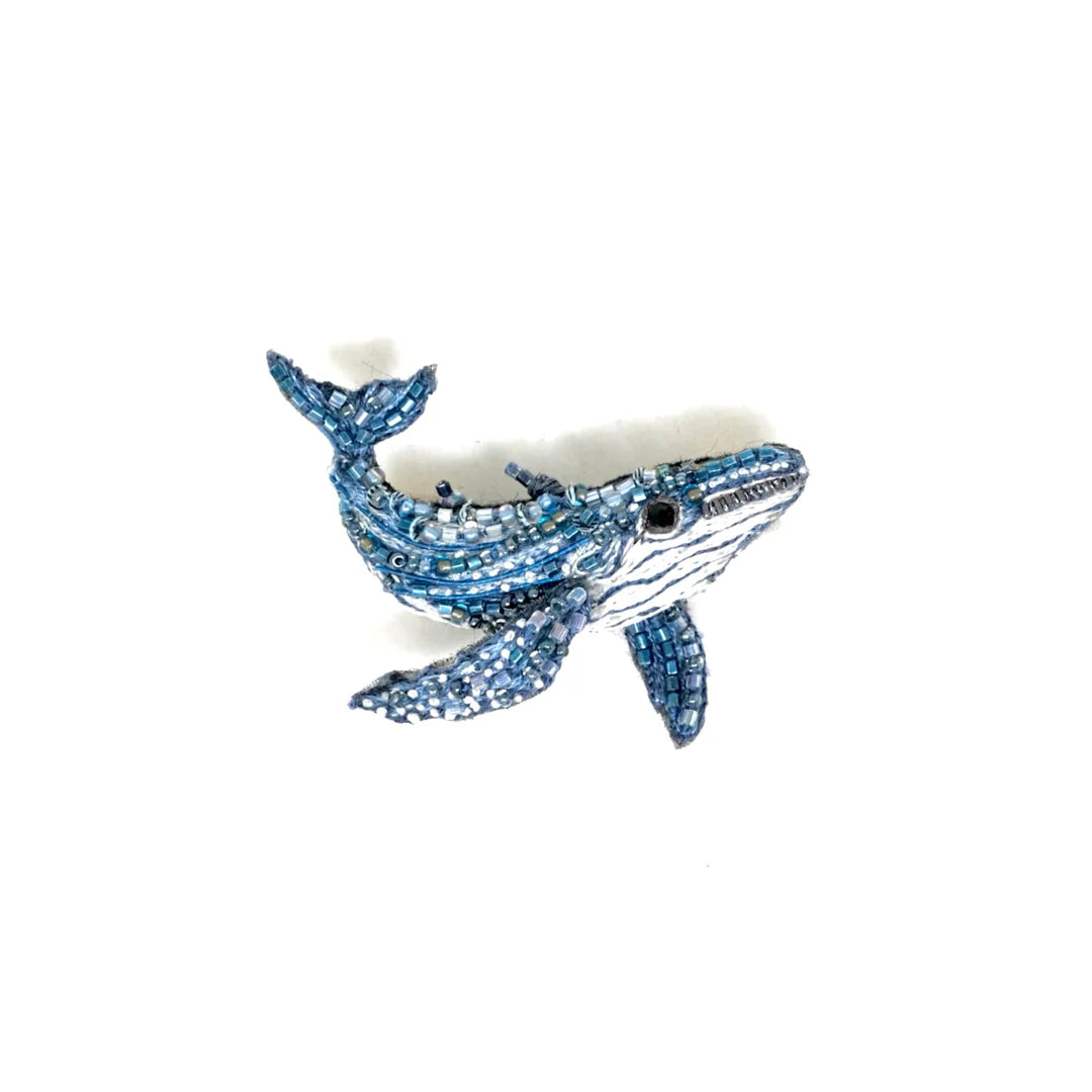 Blue beaded whale-shaped handcrafted artisan brooch with intricate beadwork, detailed fins and tail, on white background - SKU: 21285711