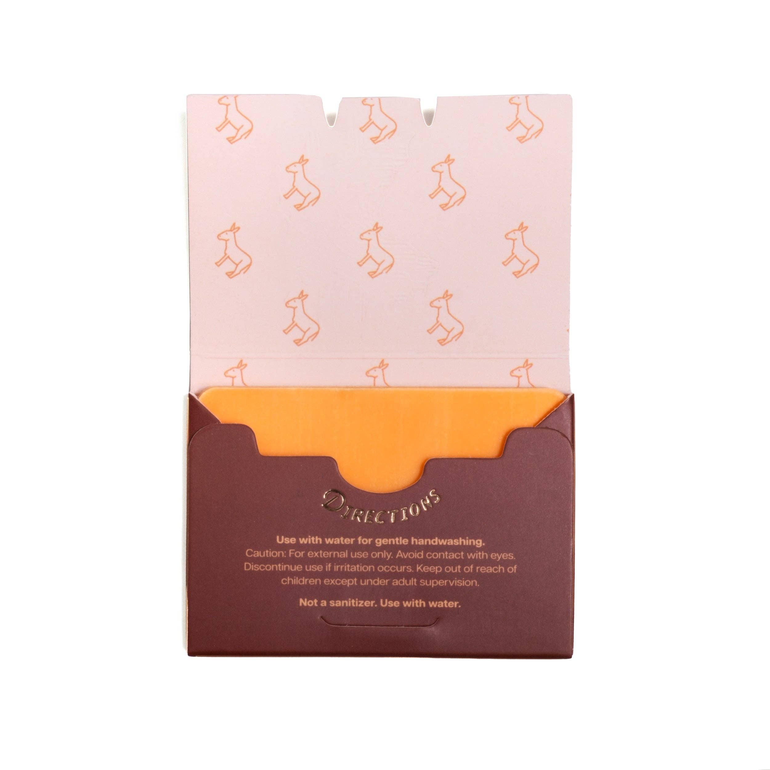 Open lid of Grand Canyon Paper Soap box revealing pink interior with printed instructions for use, featuring small mountain illustrations