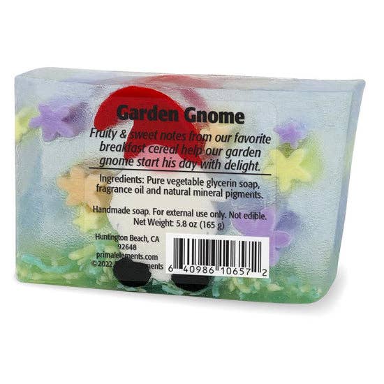 Back view of garden gnome soap packaging with ingredient list, barcode, and branding details, featuring foam flowers and gnome illustration