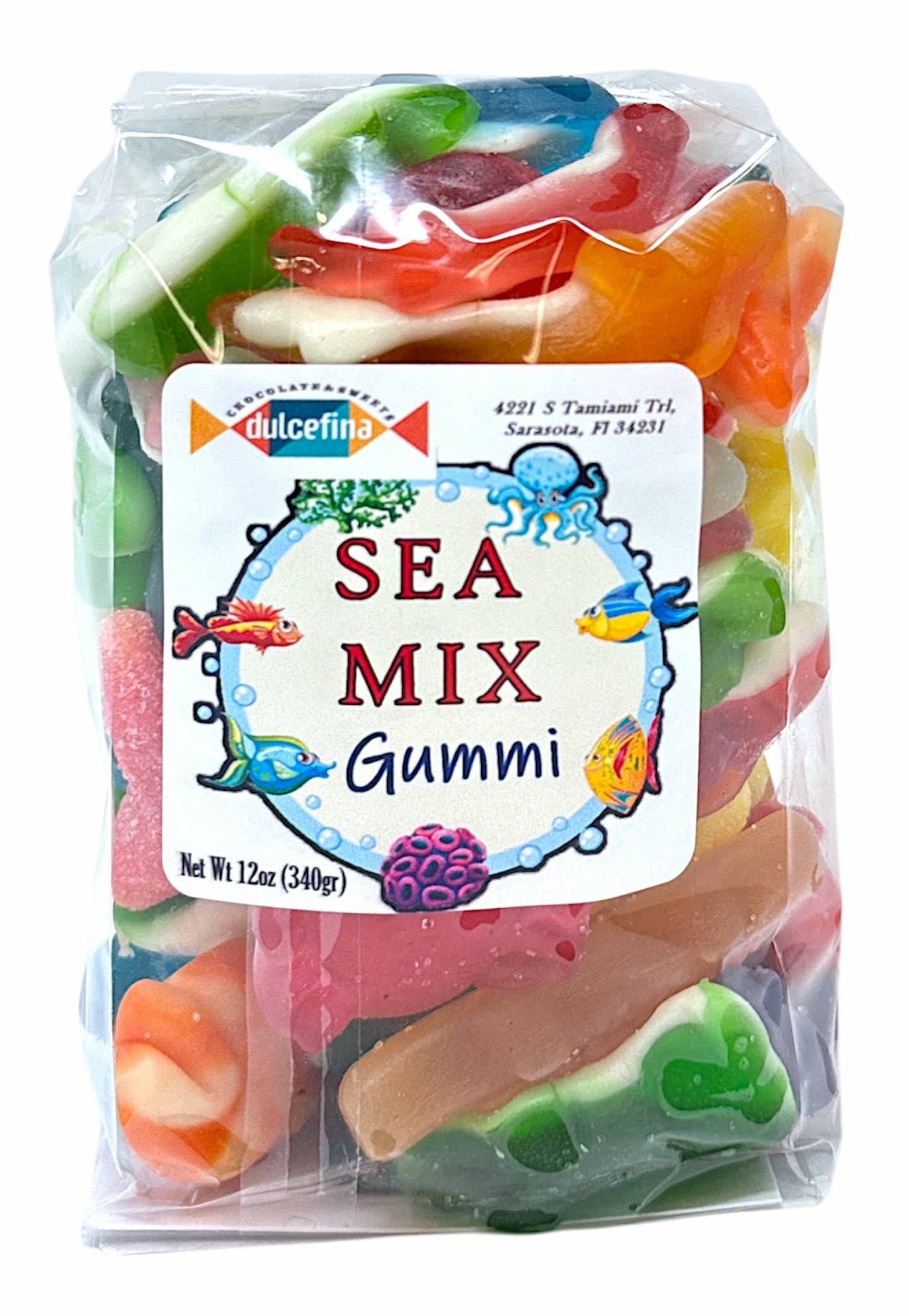Colorful sea-themed gummy candies in a clear plastic bag with a label featuring fish, octopus, and coral illustrations, 12oz net weight